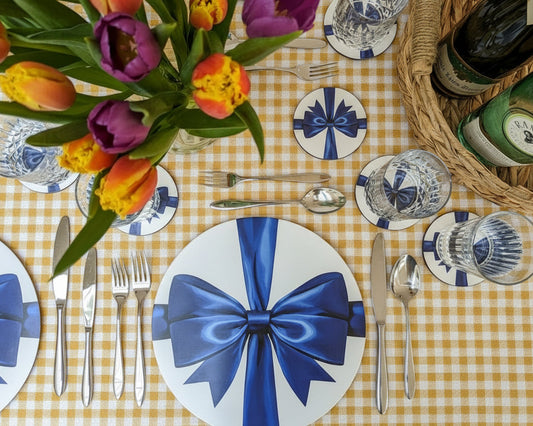 Spring colourful tablesetting with blue ribbon coasters