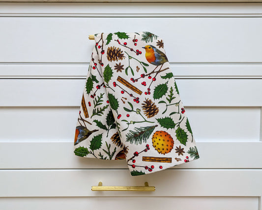 Nature inspired illustrated tea towel, crisp image with towel hanging in a beautiful warm white kitchen