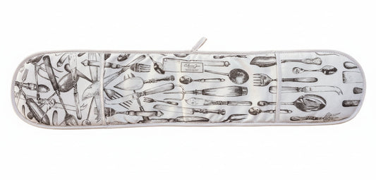 Overview of cutlery oven gloves showing the full design on a warm oak tabletop