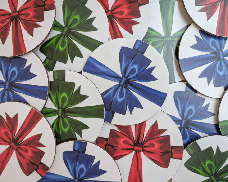 Pile of red, blue and green ribbon coasters