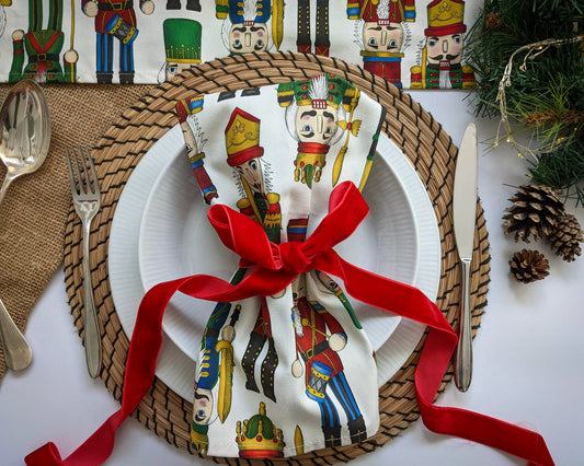 Table set for you with colourful Nutcracker napkin tied with a velvet red ribbon