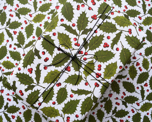 Gift wrapped in holly and berry pattern