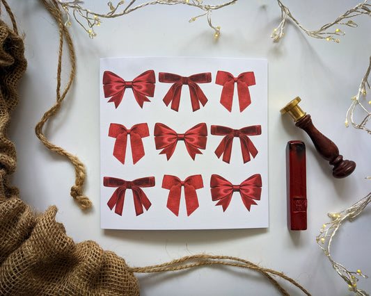 Festive mini Red ribbon card with festive props