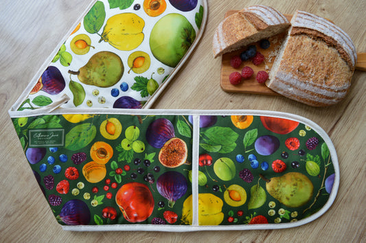 Close up of double sided print organic cotton oven gloves with colourful fruit design