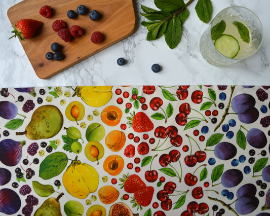 Rainbow fruit tea towel, natural background on marble top with fresh fruit and drinks