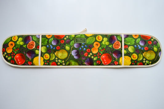 Cutout image of double oven gloves featuring British grown fruit illustrations by Catherine Jane