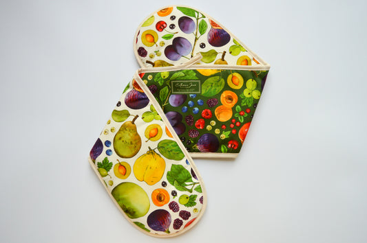 Double oven gloves with colourful fruit print, part of the kitchen textiles gift bundle made in the UK with organic cotton