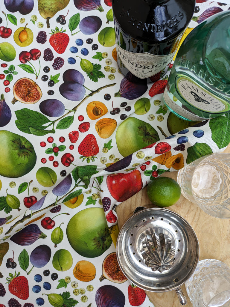 Close up of colourful fruit design on organic cotton with fresh drinks preparation