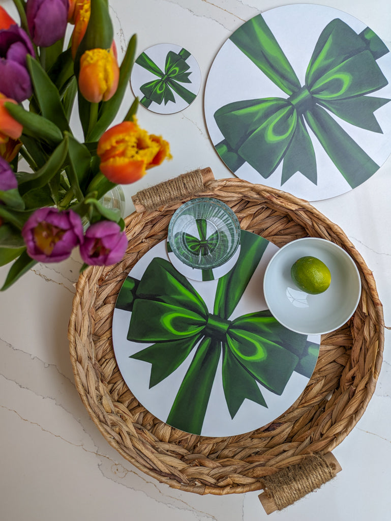 Vibrant green ribbon placemats and coasters with fresh flowers and textured tray