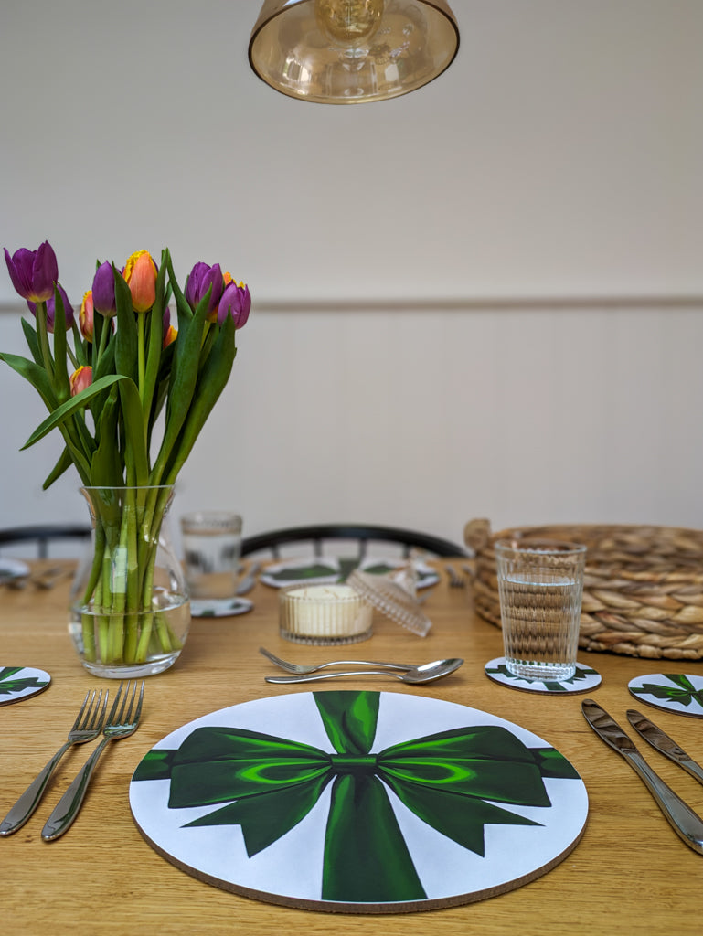 Calming placesetting with rich green ribbons