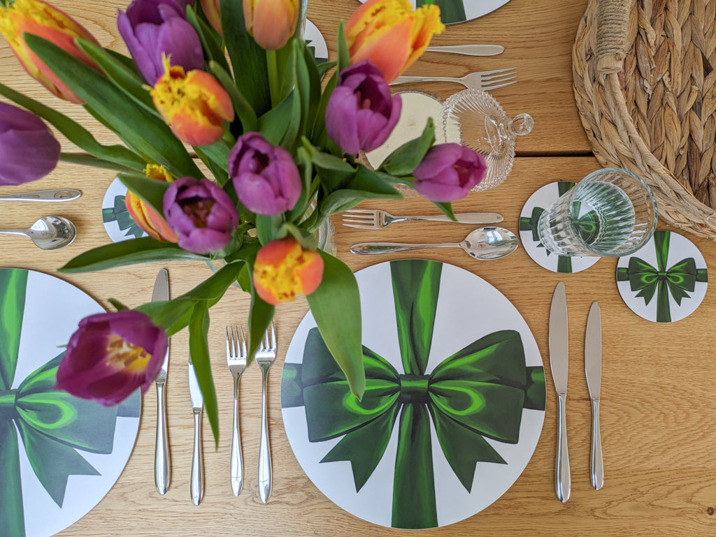 Overview of spring tablesetting with beautiful green ribbon tableware