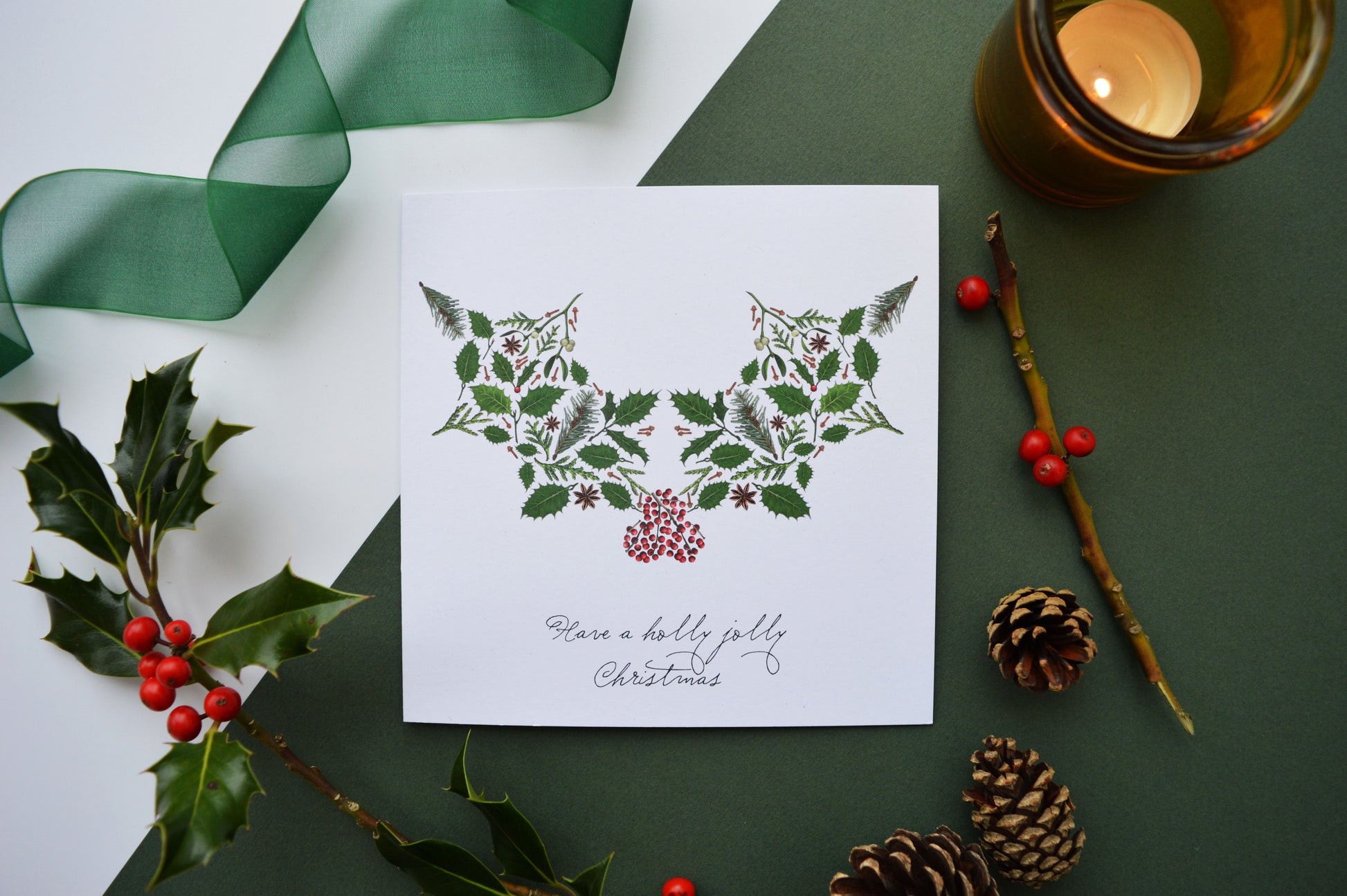 Holly and berry image made up of seasonal foliage on a recyclable card. Message reads 'Have a holly jolly Christmas'