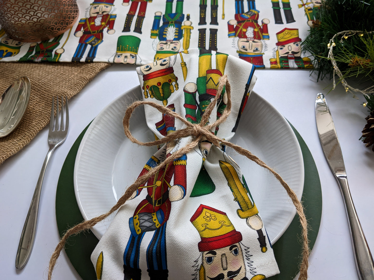 Close up of Nutcracker napkin and runner on a festive table setting