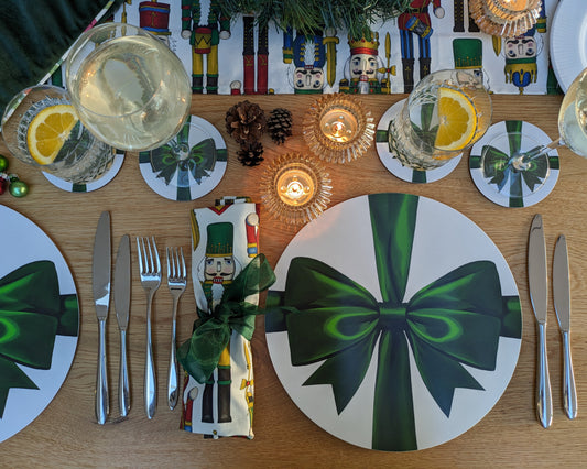 Festive cosy tablescape with nutcracker linen and rich satin ribbon placemats and coasters
