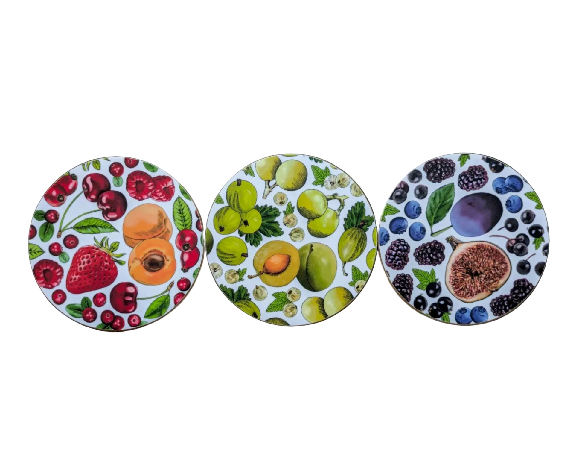 Three circular coasters with fruit illustrations. Colourful coasters