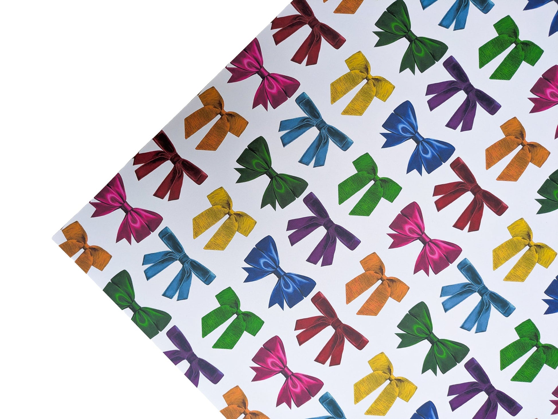 Colourful bow pattern wrapping paper on a white background