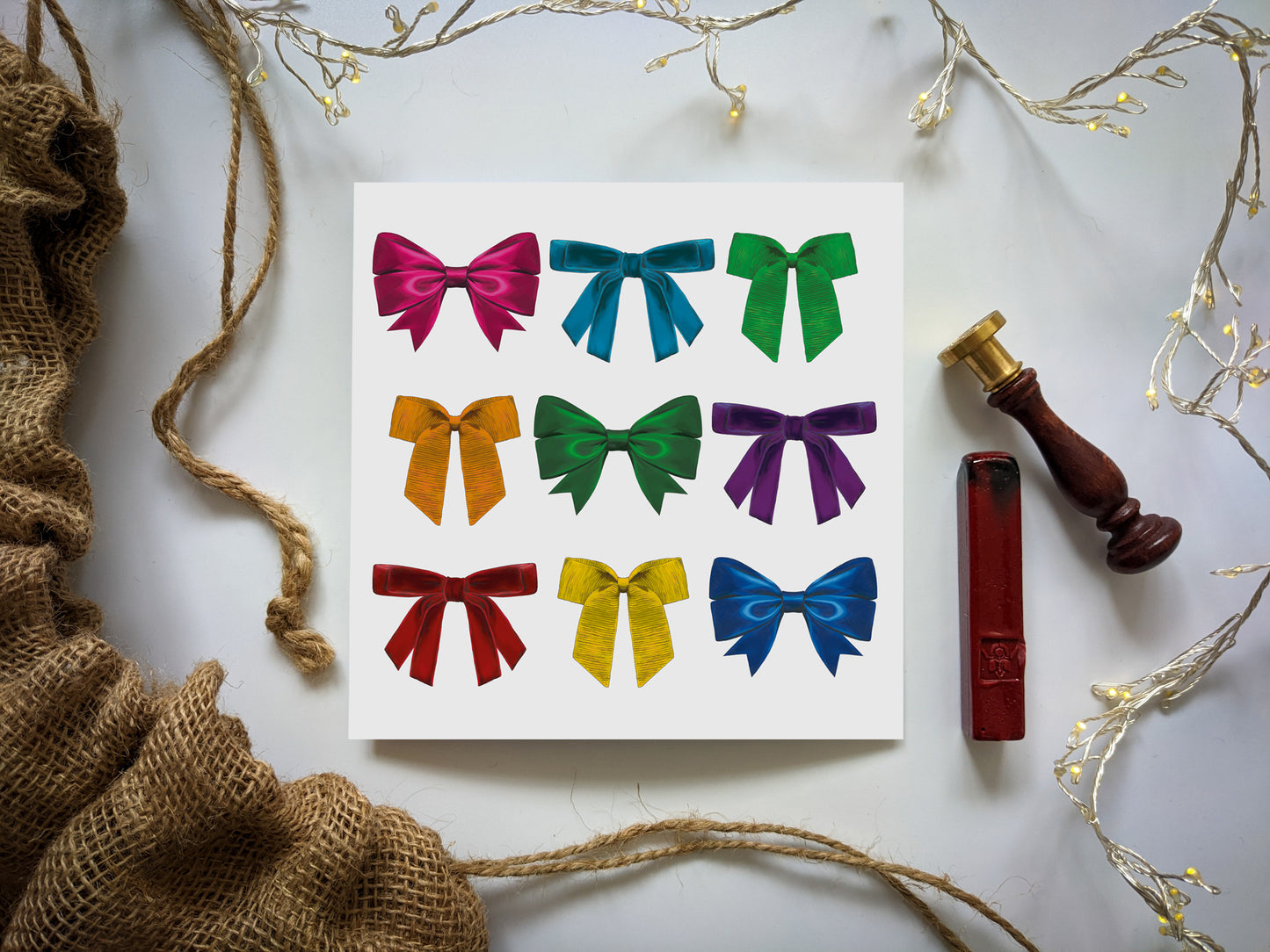 Rainbow colourful bow card with fairy lights, wax seal and hessian santa sack