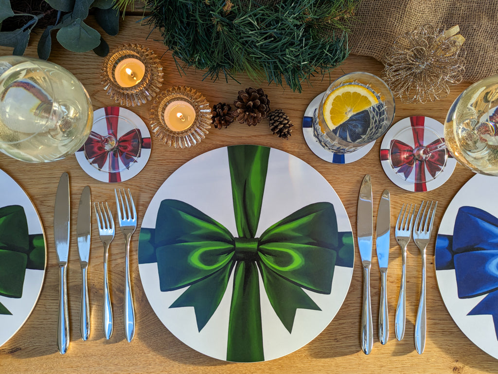 Cosy tablescape with Green, red and blue placemats and coasters