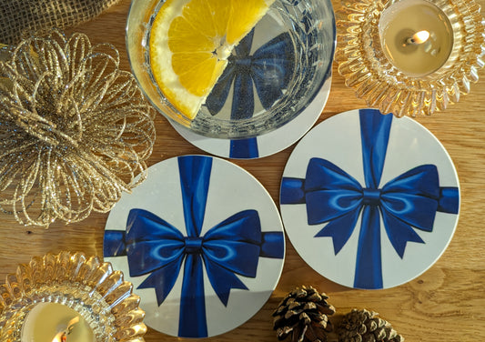 Festive warm image with drinks and blue ribbon coasters