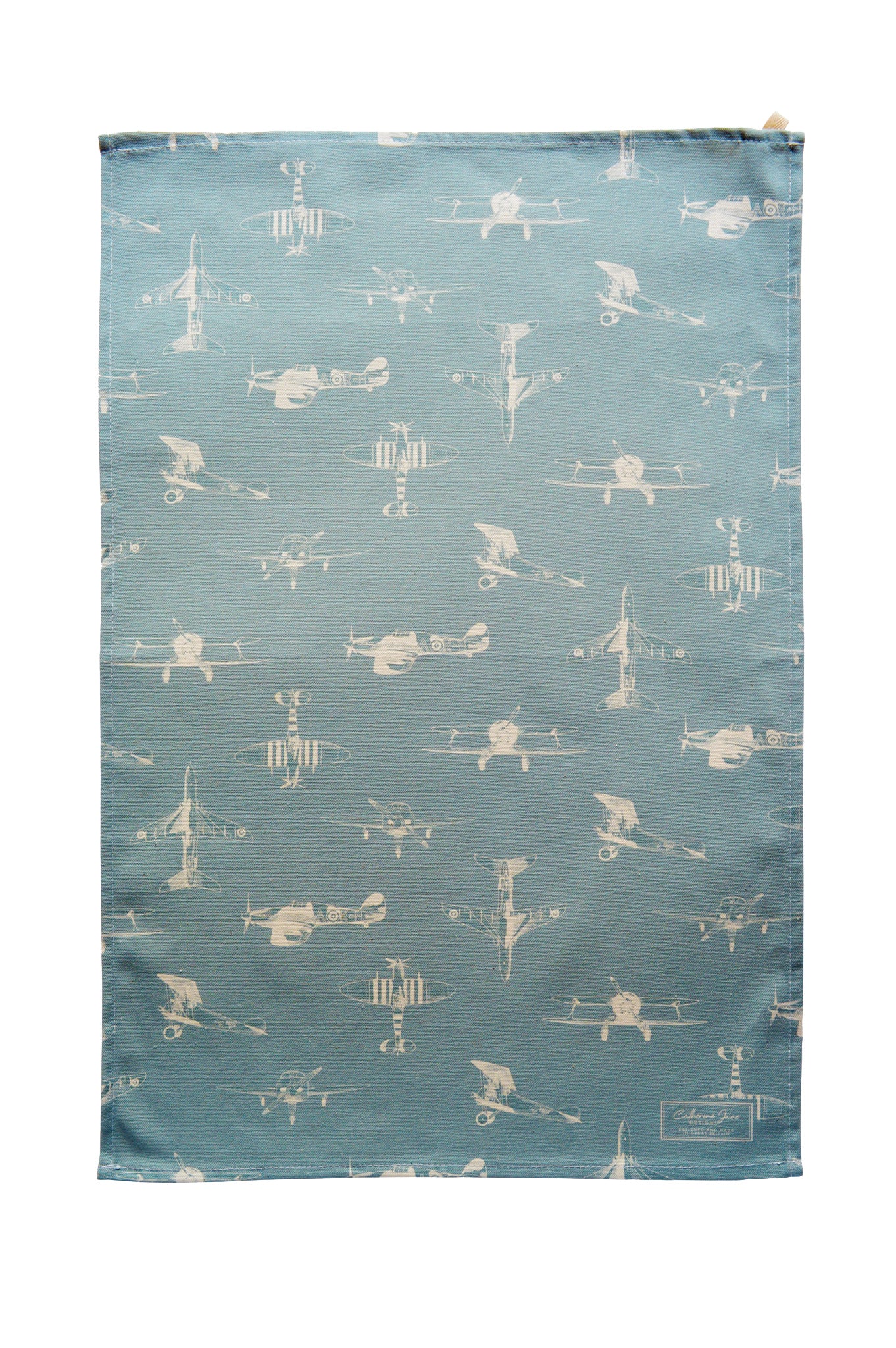 Cutout image of vintage aeroplane illustrated tea towel with a dusky blue base