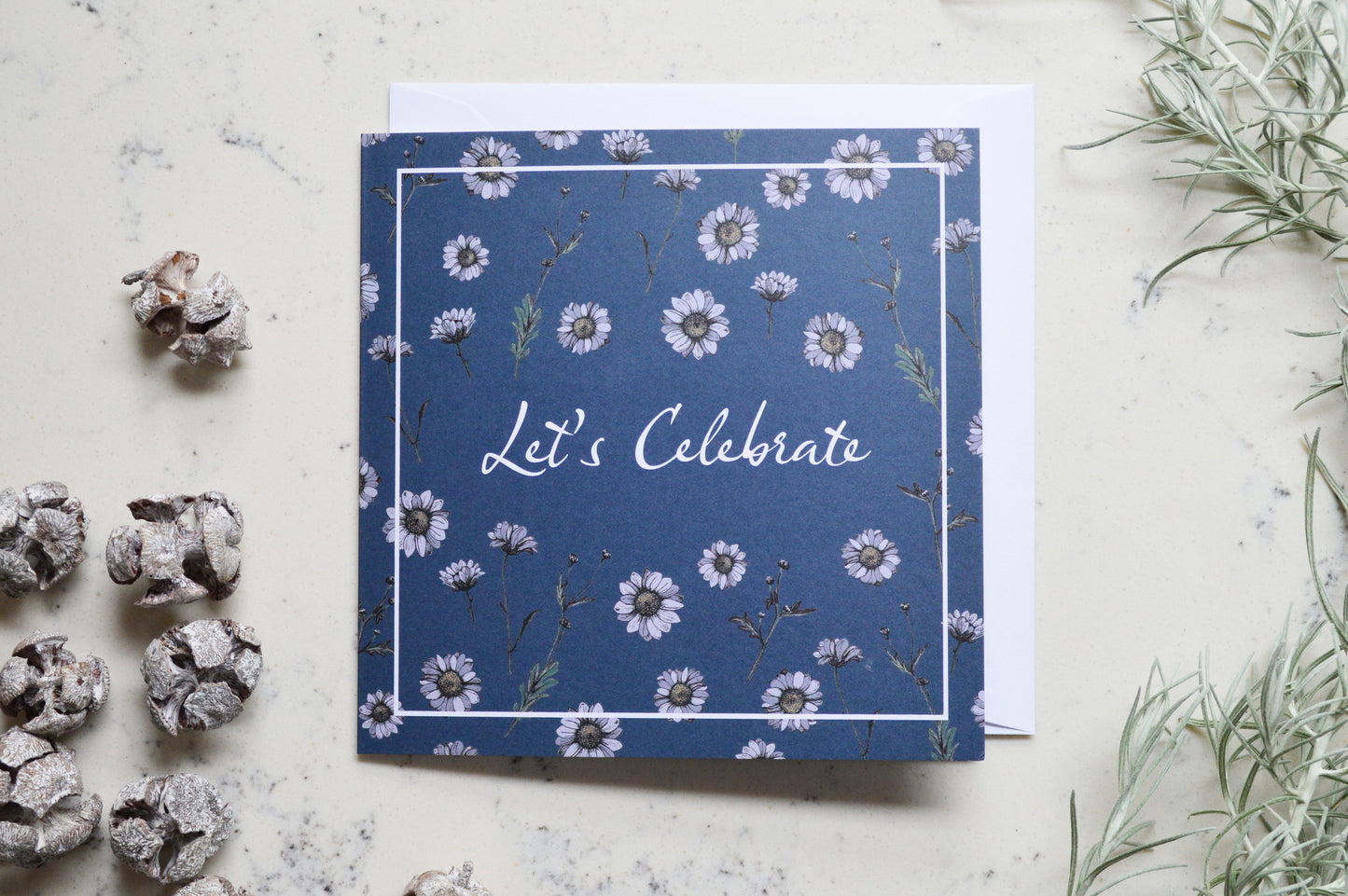 Matching Navy 'Let's Celebrate' greetings card with daisy design