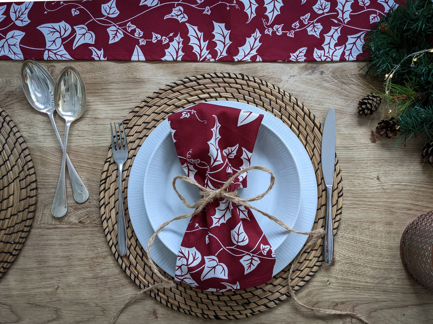 Hand drawn Christmas foliage table runner on laid table