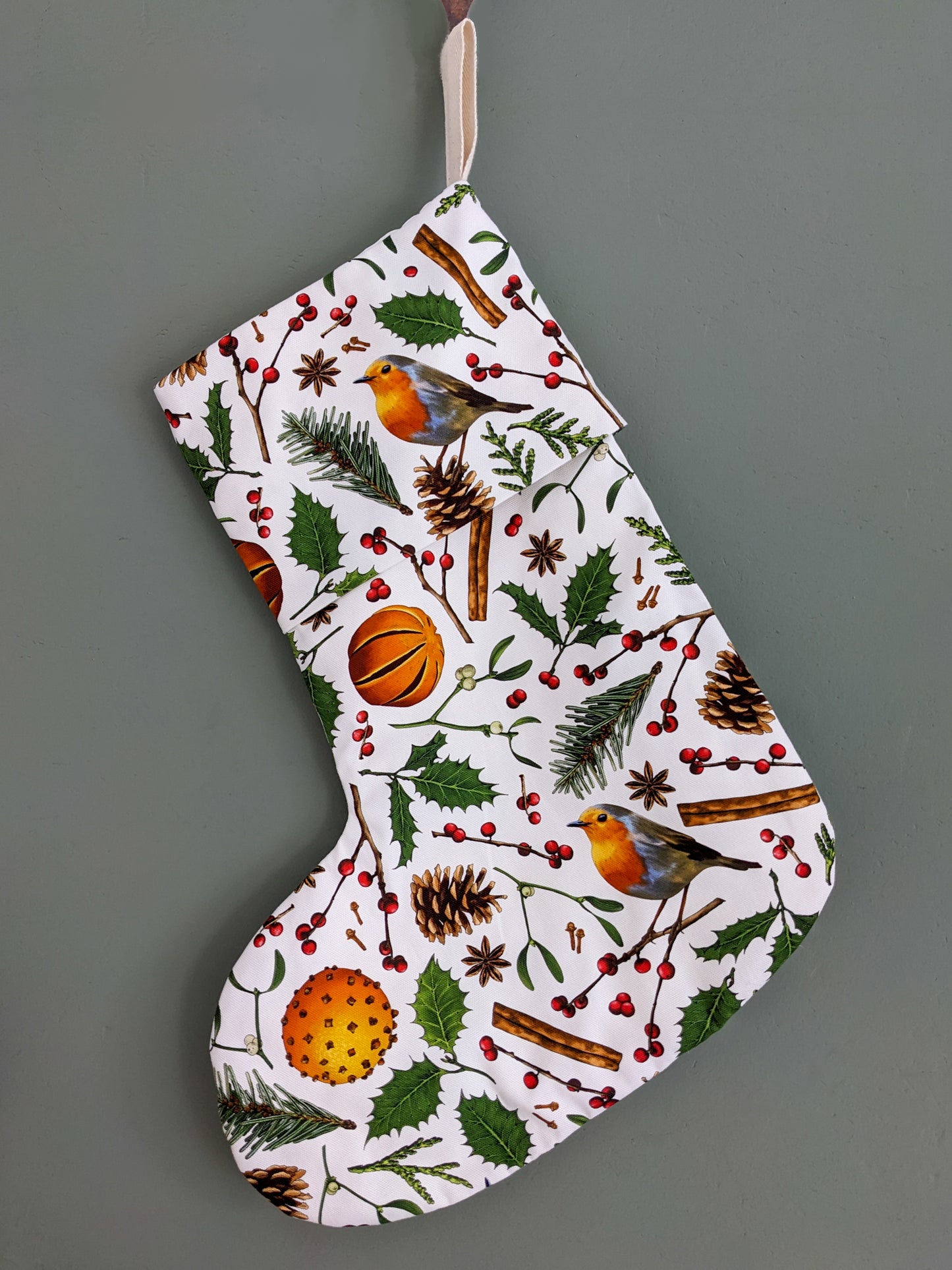 Hanging Christmas stocking in hand drawn nature elements pattern with White background 