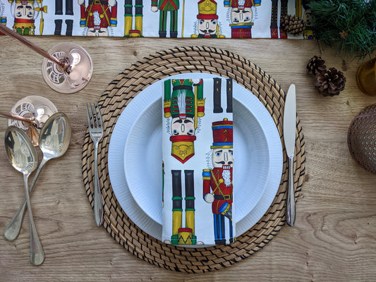 Nutcracker design Christmas Napkin and table runner on oak table