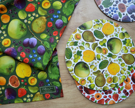 Colourful fruit print tea towel and placemats, sustainable home accessories